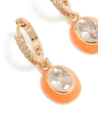 Beautifully crafted gold cubic zirconia orange enamel outer oval huggie earrings statement style in clear close up view - link has visual effect only