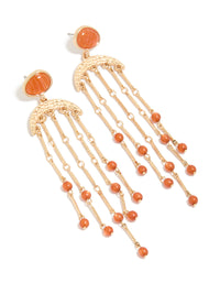 Crafted with statement style, these gold cat eye stone drop earrings feature beads and charm elements in coral and orange front view - link has visual effect only