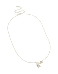 Showcasing stainless steel necklace with animal bear charm and diamante safety pin pendant close up view - link has visual effect only