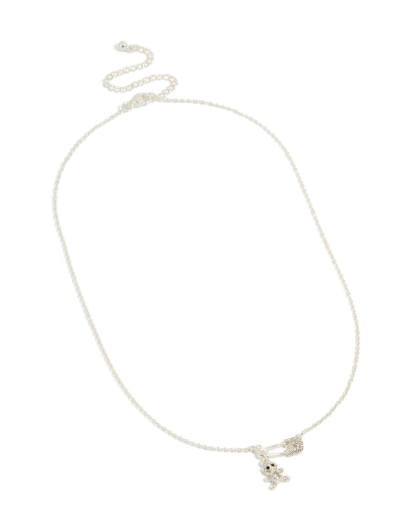 Showcasing stainless steel necklace with animal bear charm and diamante safety pin pendant close up view