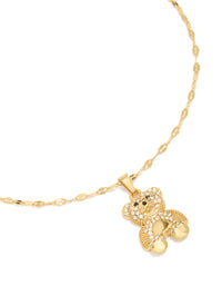 Showcasing a gold plated stainless steel pave set diamante animal bear pendant necklace front view - link has visual effect only