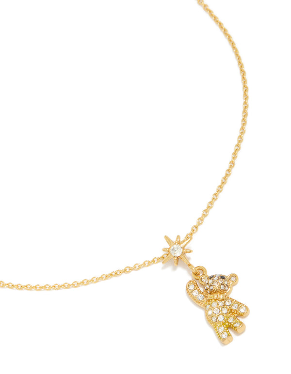 Showcasing a tweens pavé hanging bear necklace crafted from waterproof stainless steel with celestial charm featuring star and animal pendant in gold plated close up view