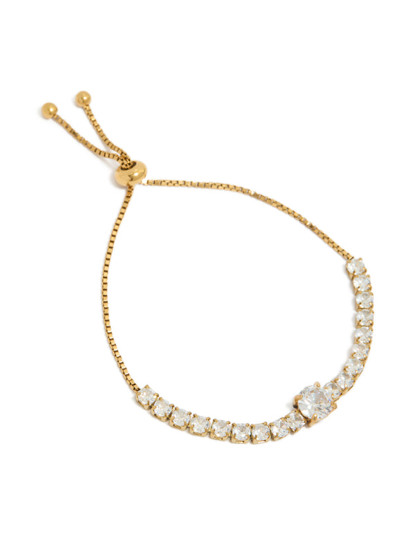 Showcasing a tweens gold plated stainless steel toggle bracelet with round cubic zirconia stones in clear, front view