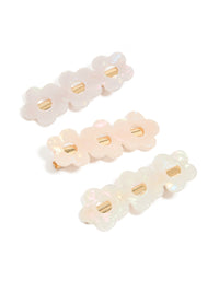 Showcasing acrylic triple flower hair clips in a 3-pack in ivory, pink, and gold detail view - link has visual effect only