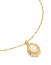 Showcasing a gold plated shell Mary locket necklace featuring ocean pendant close up view - link has visual effect only
