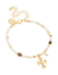 Showcasing a gold plated beaded bracelet with cross charm featuring cubic zirconia crystal accents front view - link has visual effect only