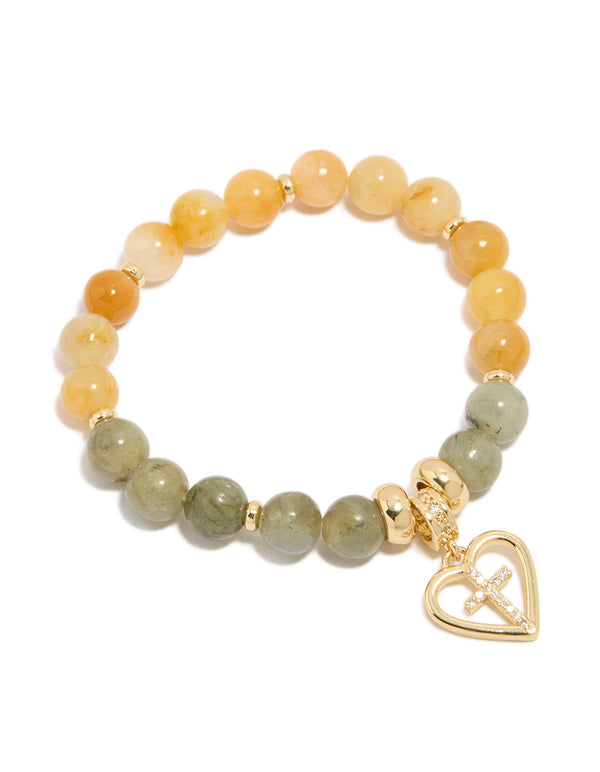 Showcasing a gold plated beaded bracelet with cross and heart in cubic zirconia, chunky statement design front view