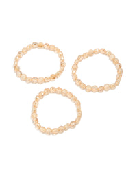 Showcasing amber beaded stretch bracelets in a 3-pack with wheat and burlywood tones front view - link has visual effect only