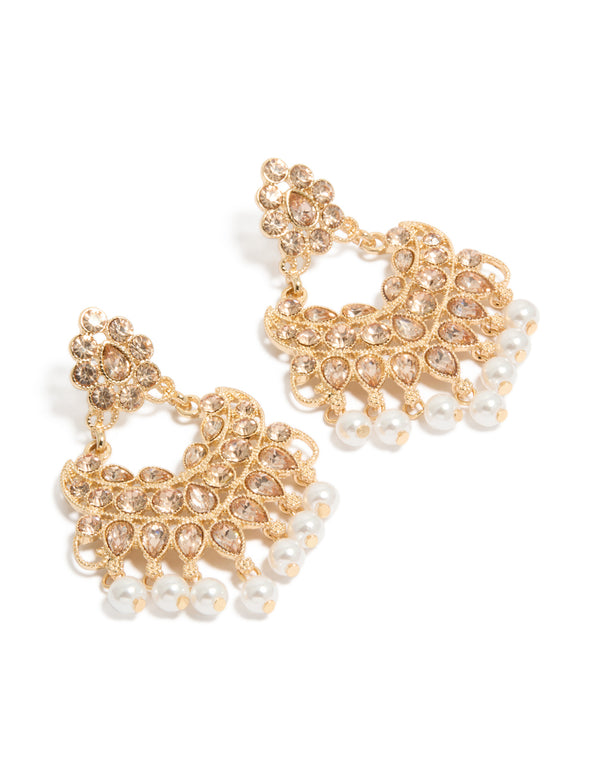 Featuring gold diamante and pearl statement drop earrings front view