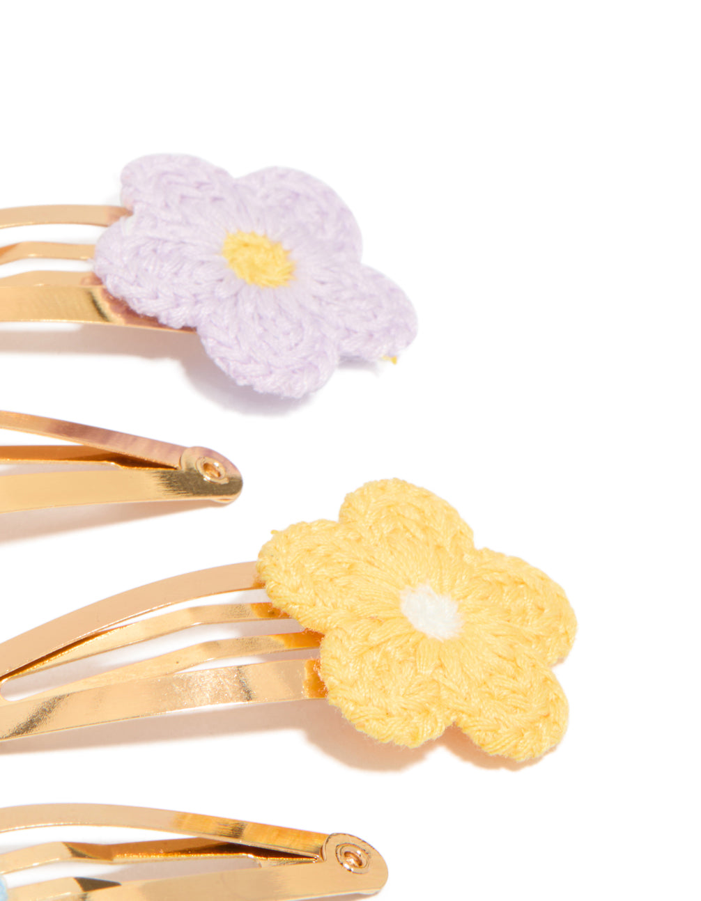 Featuring kids pastel crochet flower snap clips in a 4-pack, with floral design crafted from gold plated material in pink, lavender, yellow, and light blue side view