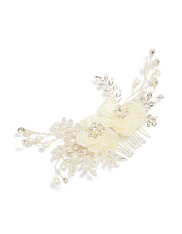 Crafted with floral and leaf accents, this pearlised comb in silver features ivory and white tones detail view - link has visual effect only
