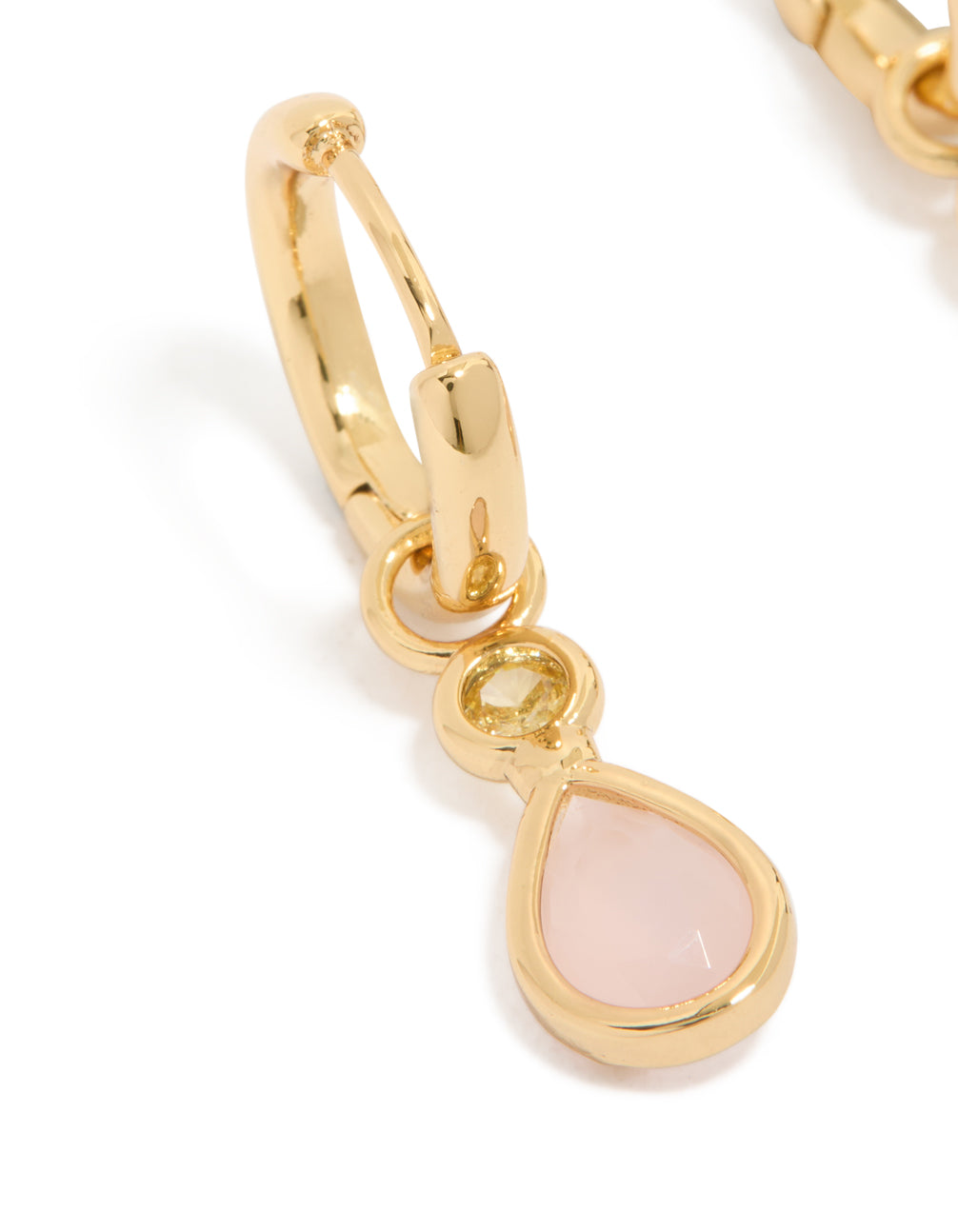 Highlighting gold plated pink cubic zirconia teardrop huggie earrings in dainty style close up view