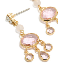 Featuring gold plated clear bead and diamante drop earrings with charm details close up view - link has visual effect only