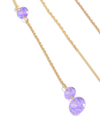 Highlighting the intricate detail of purple cubic zirconia stone settings on gold plated chain close up view - link has visual effect only