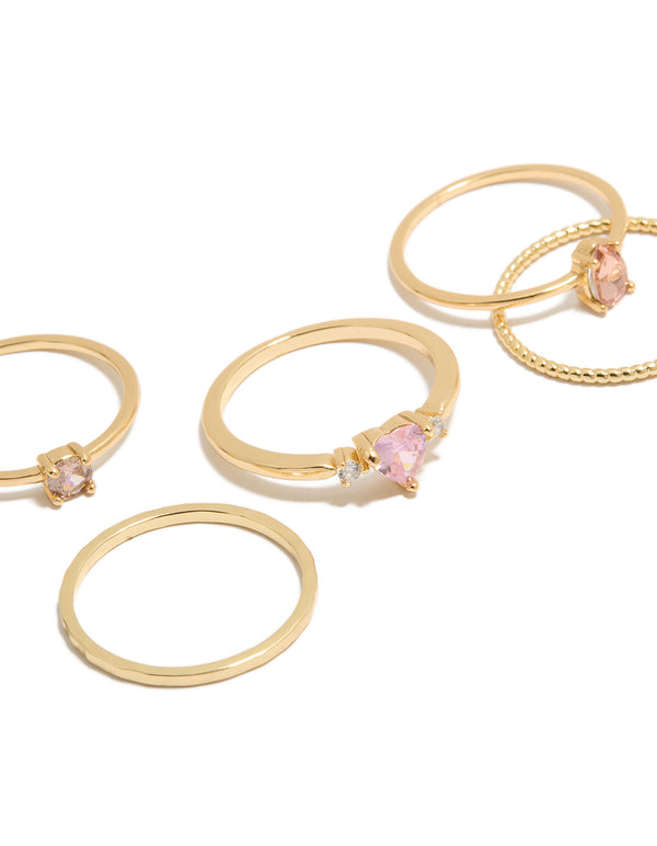 Featuring gold plated pink heart cubic zirconia and molten rings 5-pack with crystal detailing close up view