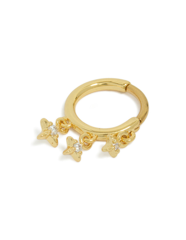 Showcasing a gold plated surgical steel clicker ring featuring celestial star charms with cubic zirconia, dainty design in gold front view