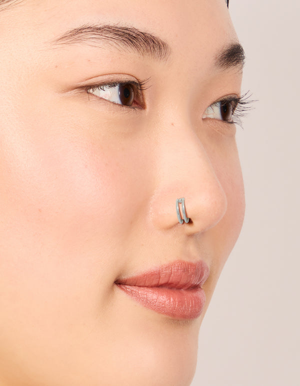 Crafted from surgical steel double hinged and plain nose rings pack in silver nose view