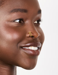 Showcasing gold plated surgical steel double hinged nose rings in a pack nose view - link has visual effect only