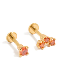 Showcasing titanium stud earrings with flat back closure in gold featuring red cubic zirconia stones front view - link has visual effect only