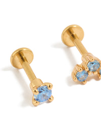 Stunning gold plated titanium flat back studs with blue cubic zirconia crystals close up view - link has visual effect only
