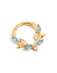 Showcasing a gold plated titanium clicker ring with blue and clear cubic zirconia stones front view - link has visual effect only