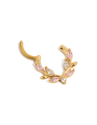 Showcasing a stunning clicker ring in gold plated titanium adorned with pink and clear cubic zirconia in statement detail view - link has visual effect only