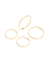 Featuring wide flat hoop earrings in a 2-pack, crafted from gold plated material with statement styling and hoop closure front view - link has visual effect only