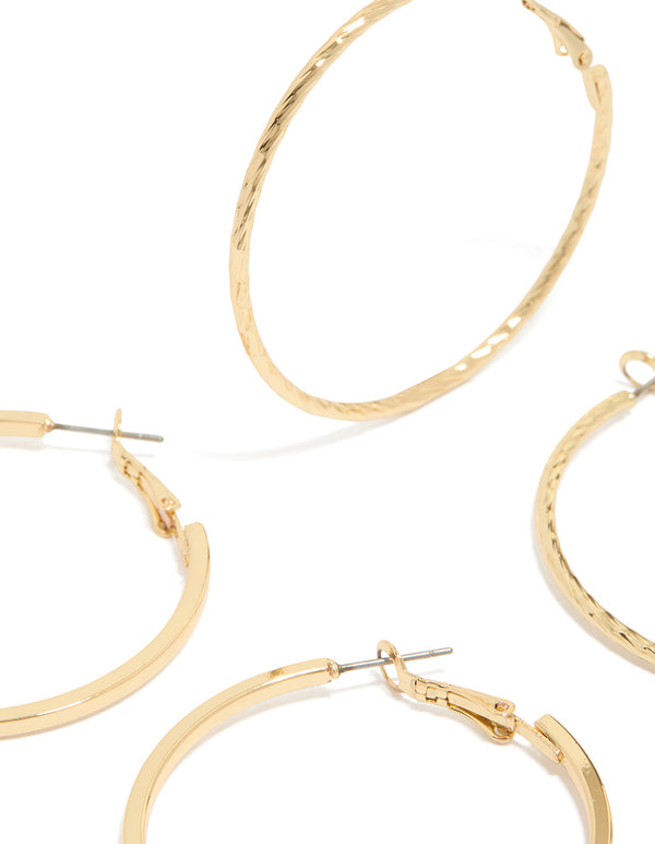 Showcasing gold plated smooth and textured hoop earrings in a 2-pack with hoop closure close up view