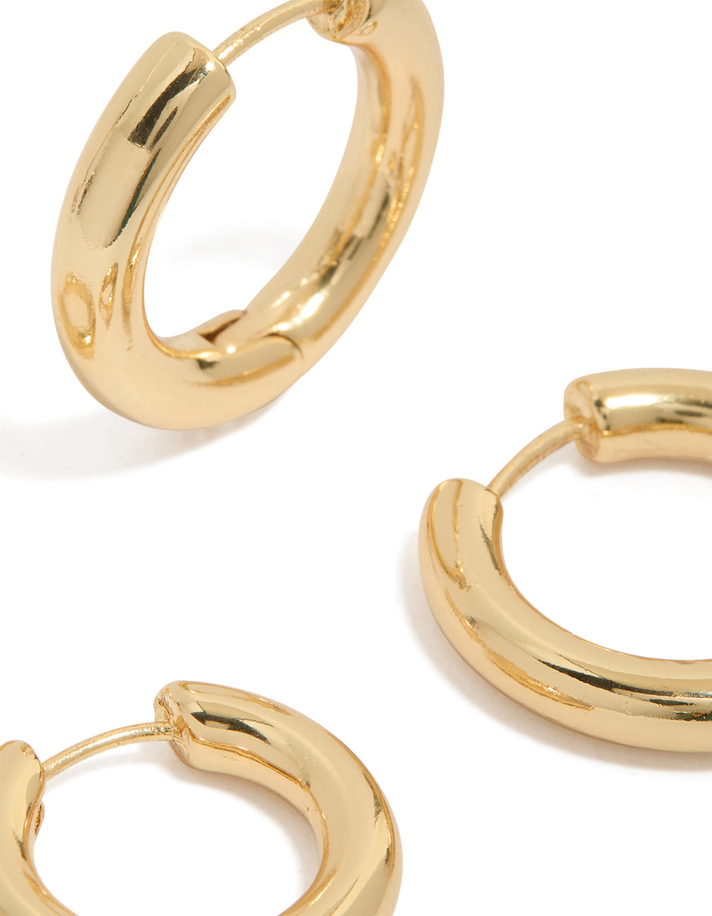 Crafted from gold plated material, plain thin huggie earrings 2-pack with hoop closure post detail view