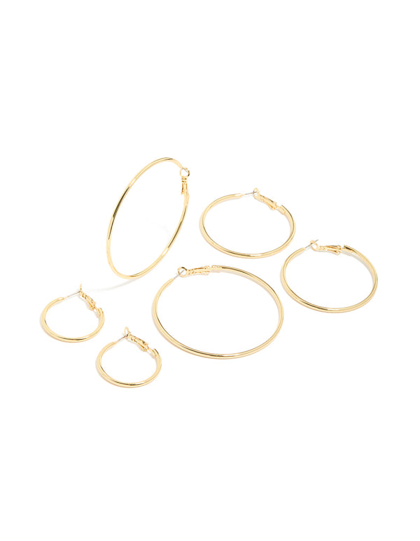 Featuring gold plated small and medium hoop earrings in a 3-pack front view