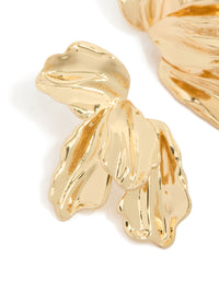 Crafted with intricate organic texture and petal detailing in statement half floral gold plated earrings close up view - link has visual effect only