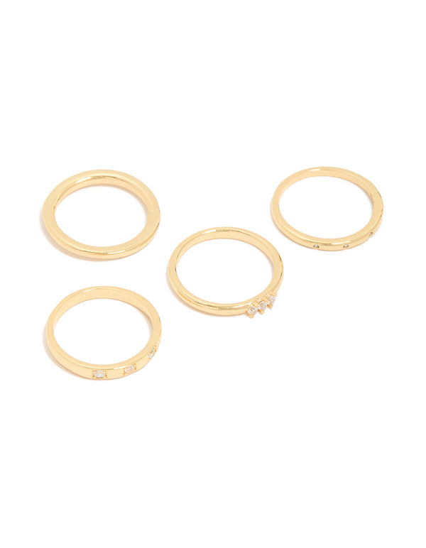 Showcasing a 4-pack of gold plated rings with cubic zirconia inlay front view