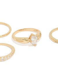 Beautifully crafted gold plated bezel set cubic zirconia band rings 4-pack with oval cut crystal stones close up view - link has visual effect only