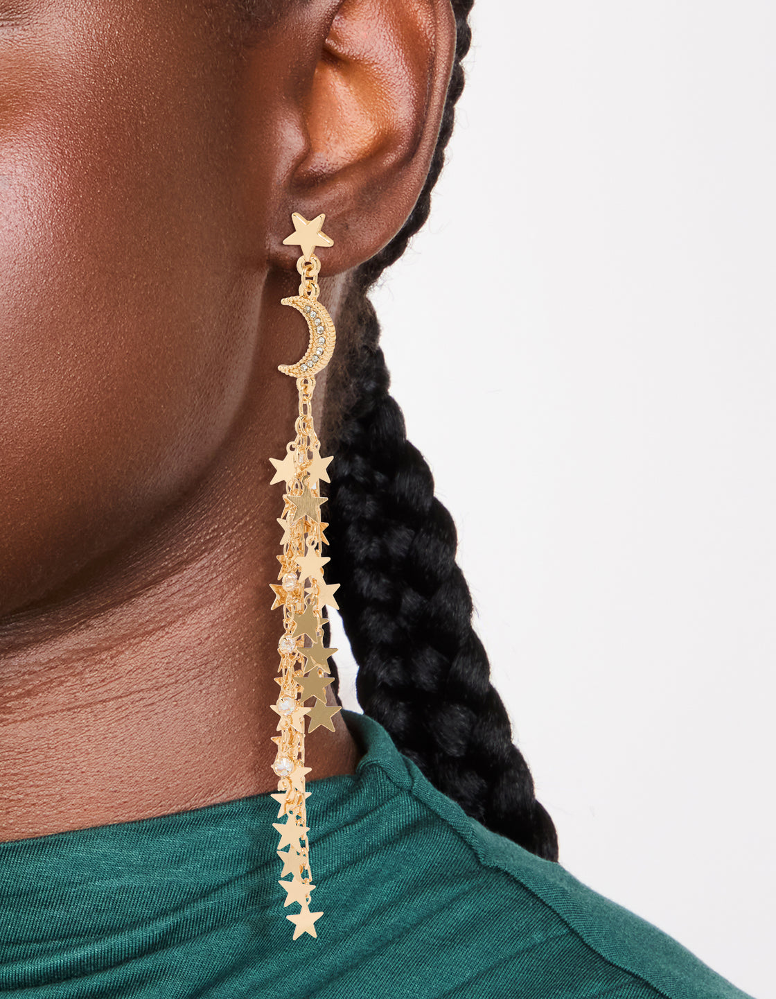 Featuring gold star and moon chain drop earrings with celestial charm design on ear view