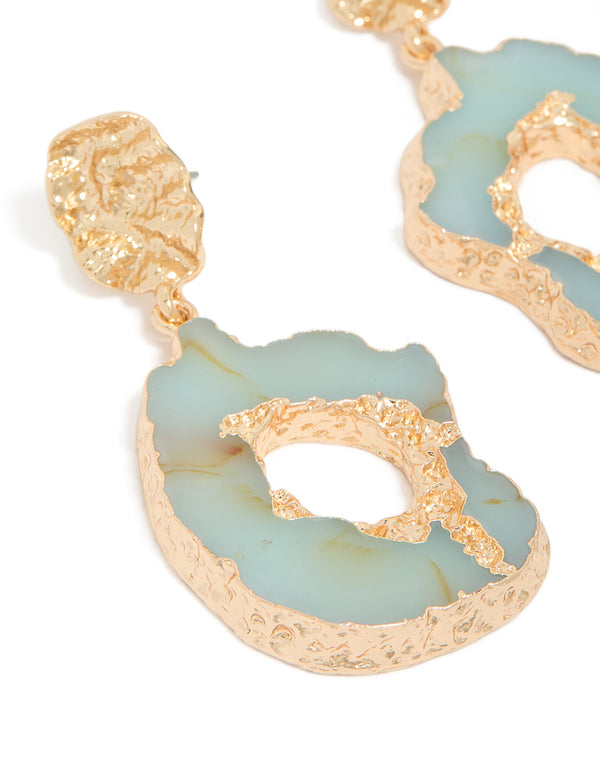 Beautifully crafted worn gold open blue amazonite semi precious stone drop earrings with statement design close up view