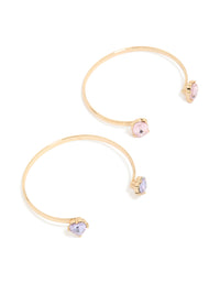 Showcasing a 2-pack of gold bangle bracelets with pink and purple diamantes front view - link has visual effect only
