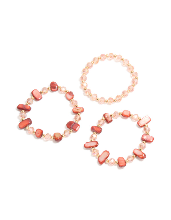 Explore these beaded stretch bracelets featuring shell details in light coral, light pink, and gold tones as a 3-pack front view
