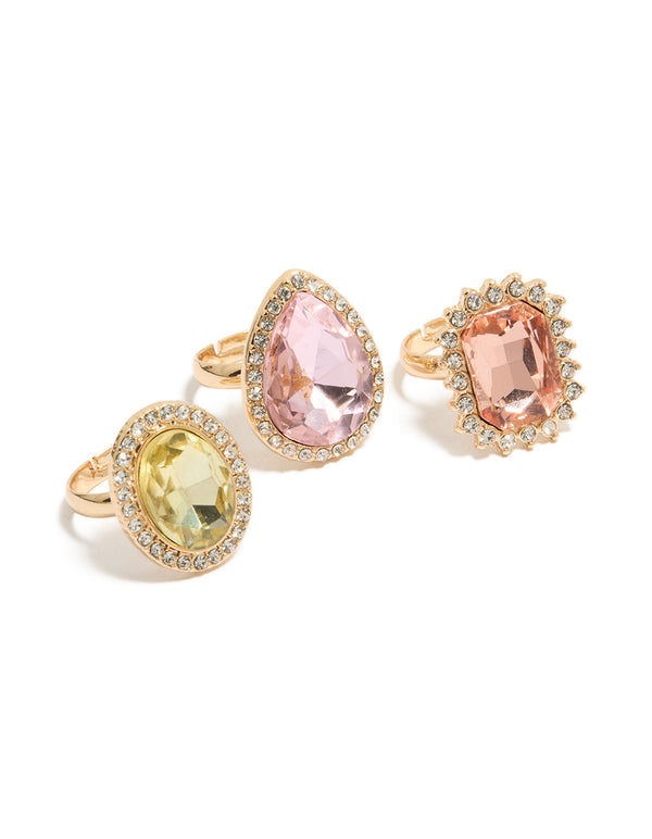 Showcasing gold pink and purple pastel diamante rings in a 3-pack with halo and oval stone cut featuring statement style view