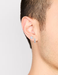Featuring mens waterproof stainless steel square cubic zirconia and huggie earrings in a 2-pack with crystal accents, hoop closures, and silver tone on ear view - link has visual effect only