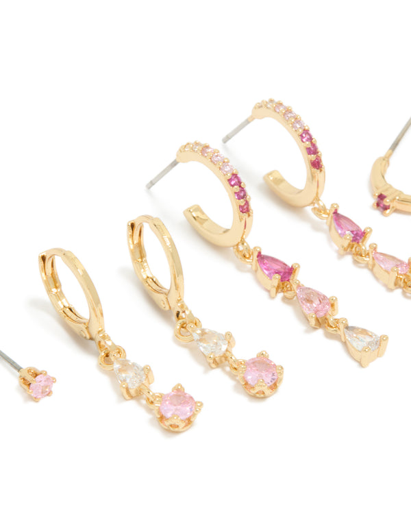 Beautifully crafted stacker earrings in gold plated finish with clear and light pink cubic zirconia crystals, huggie closures, 4-pack close up view