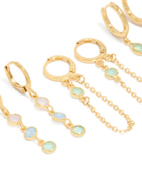 Featuring dainty stacker earrings crafted from gold plated cubic zirconia with crystal accents in lilac and blue, designed with huggie and stud closures as a 4-pack close up view - link has visual effect only