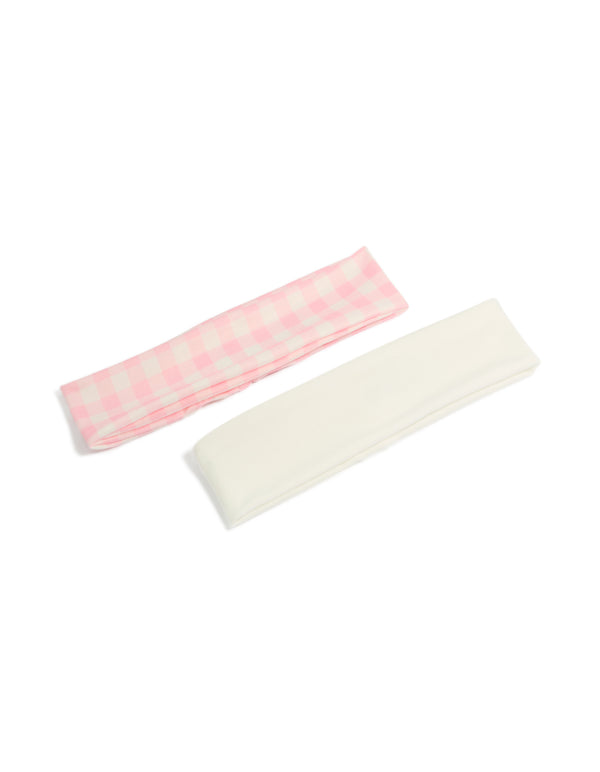 Featuring a checkered 2-pack of pink and white stretch headbands front view