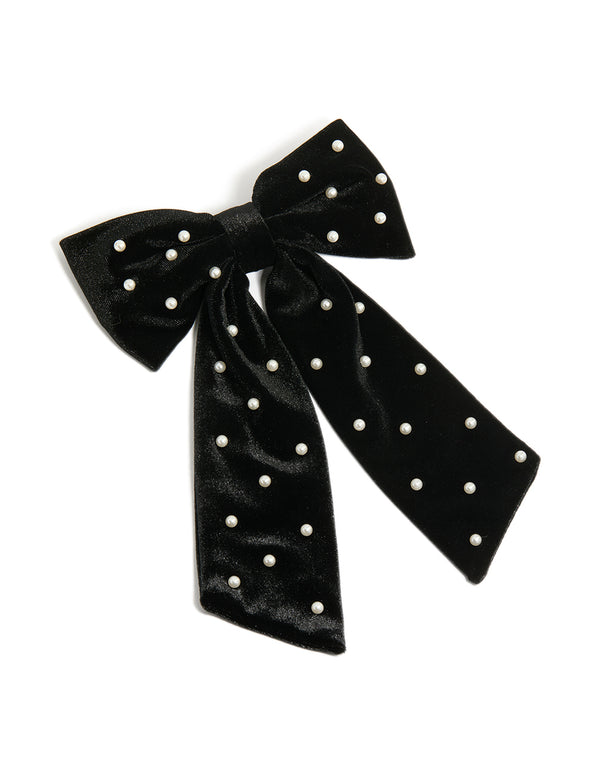 Beautiful black velvet bow clip featuring polkadot print with pearl embellishments statement style front view