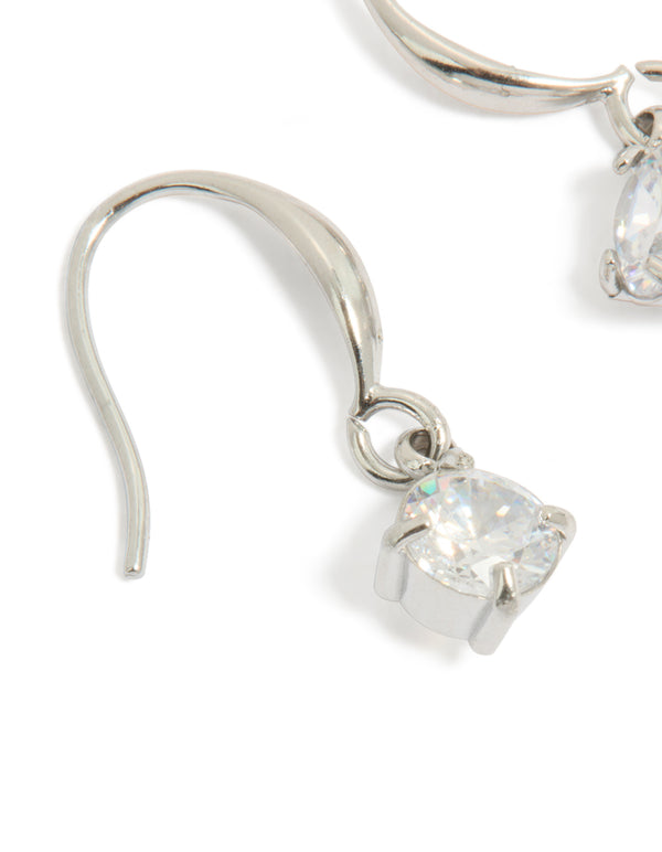 Designed with waterproof stainless steel sleek drop earrings featuring round cubic zirconia in silver close up view
