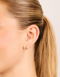 Showcasing waterproof gold plated stainless steel pink cubic zirconia huggie earrings on ear view - link has visual effect only