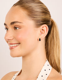 Designed with waterproof black coated stainless steel, these chunky huggie earrings on model view - link has visual effect only