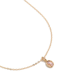 Beautifully crafted pink diamante round pendant charm necklace in gold featuring a delicate chain close up view - link has visual effect only