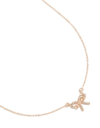 Showcasing a rose gold dainty diamante bow pendant necklace front view - link has visual effect only