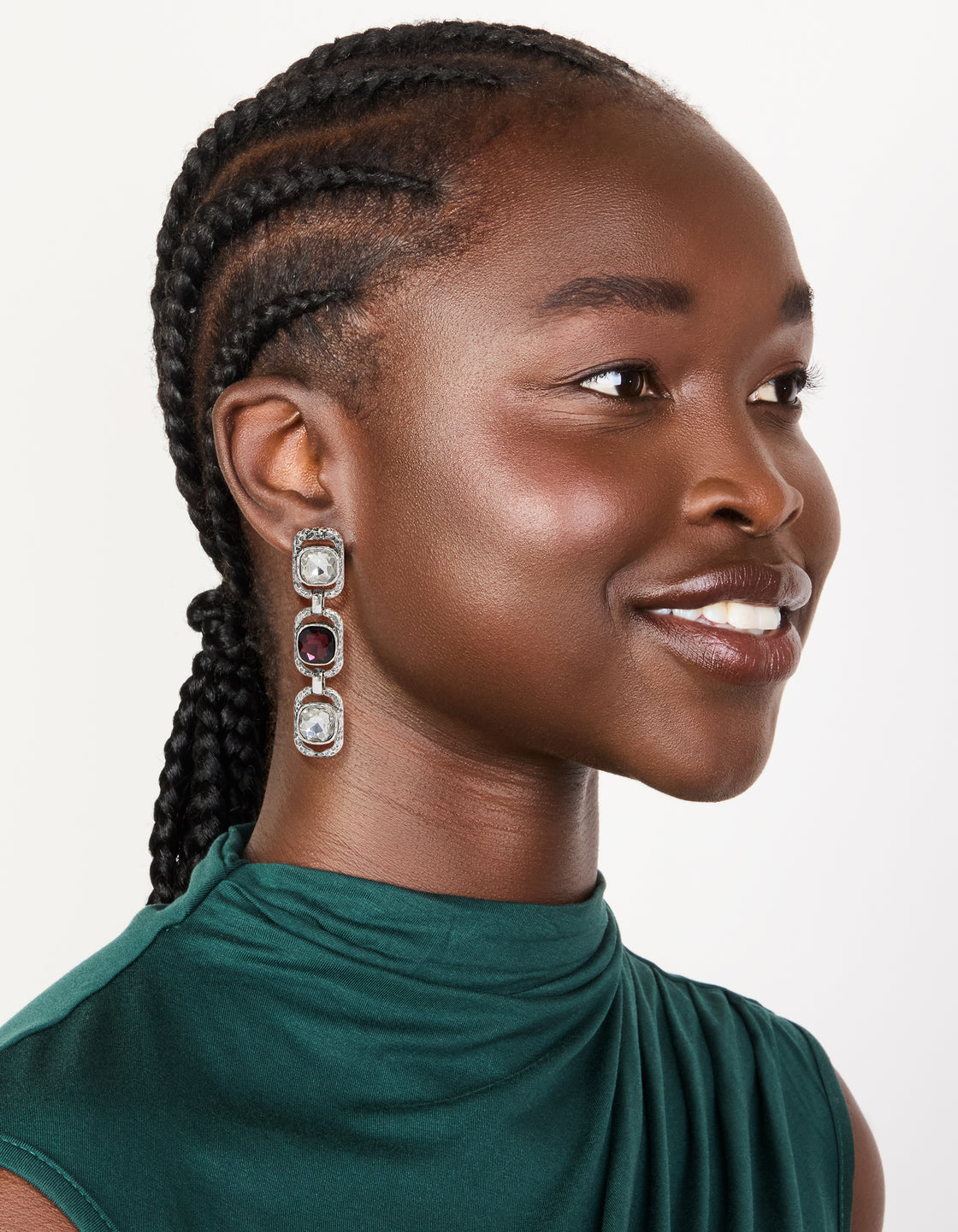 Discover chunky statement drop earrings in silver with burgundy and clear diamante stones on model view