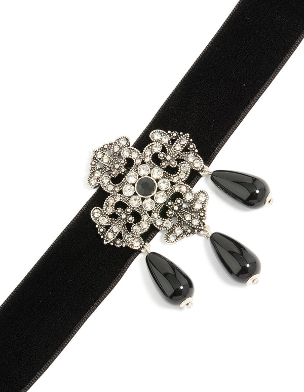 Featuring a diamante art deco design with charm beads in statement style choker necklace close up view